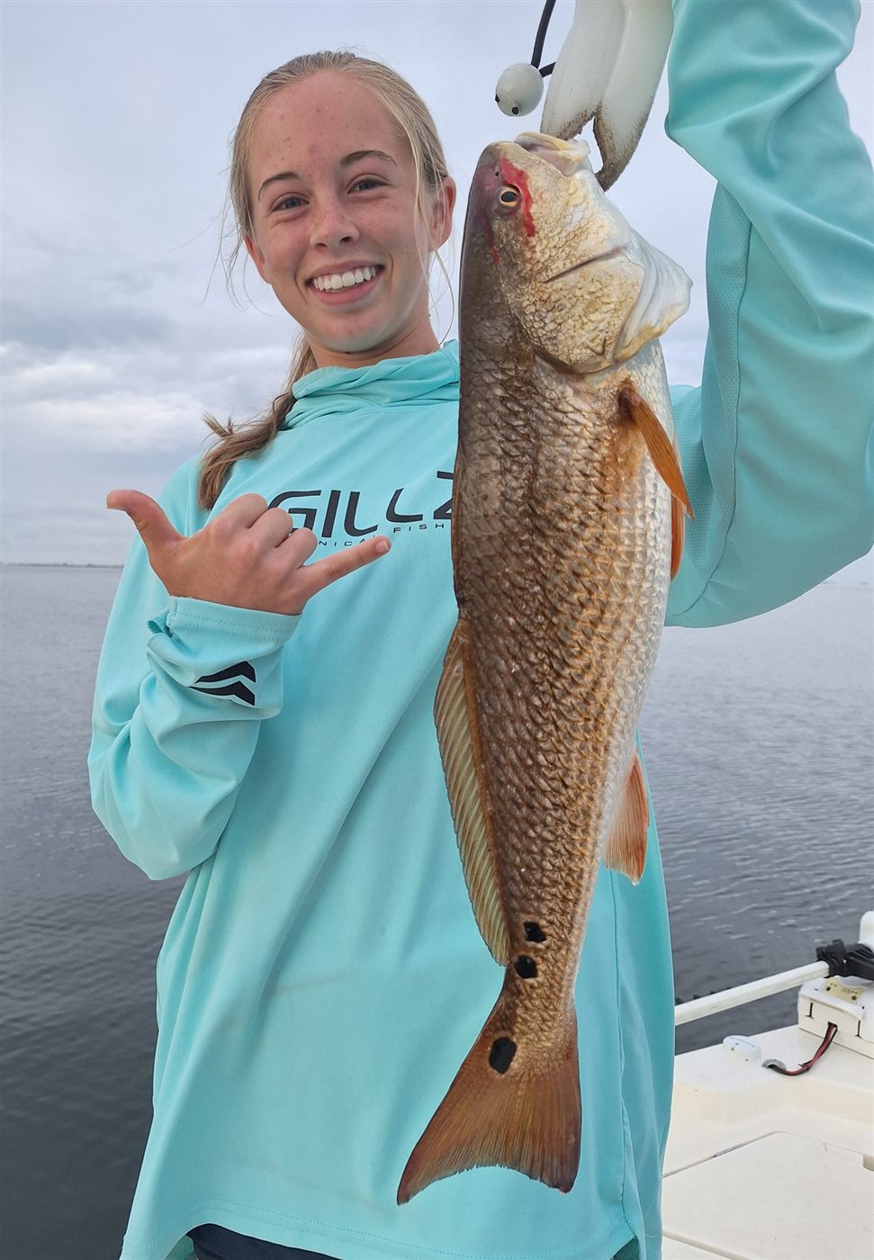 Angler holding a redfish